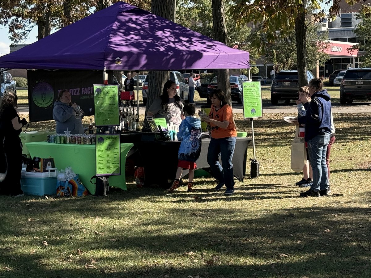 A community vendor tent at the event in the park